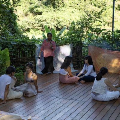 People participating in a group sound healing and meditation session at Miraclevie Sound Healing sanctuary.
